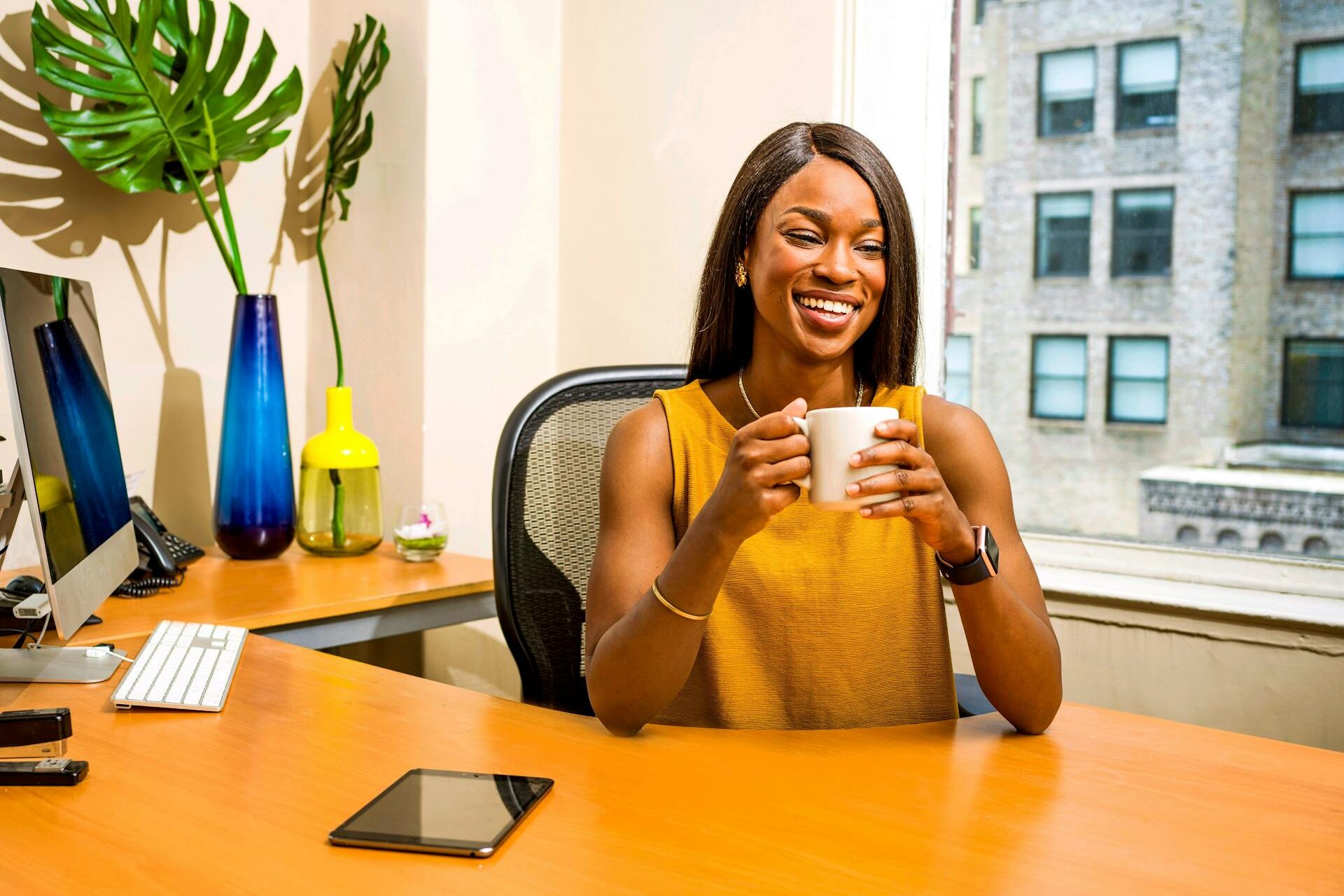 businesswoman smiling with coffee